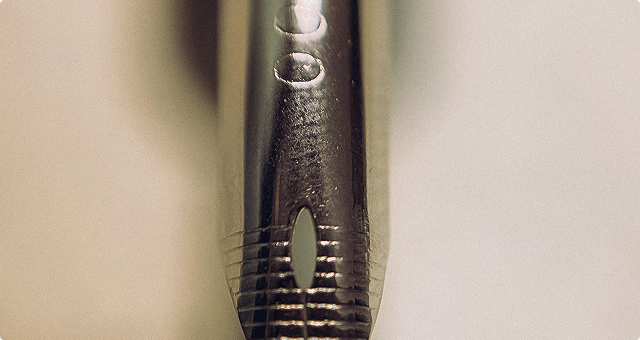 A letterpress workshop with a proof pinned above the bed